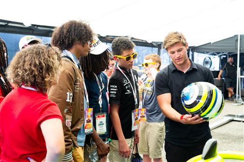 Christian Brooks showing students his helmet